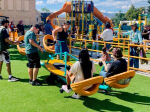 Students enjoying the new playground at its ribbon cutting.