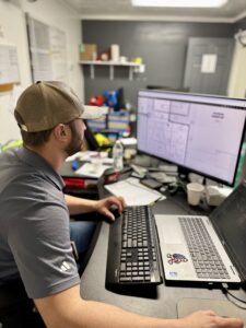 Joe McCormick at His Computer